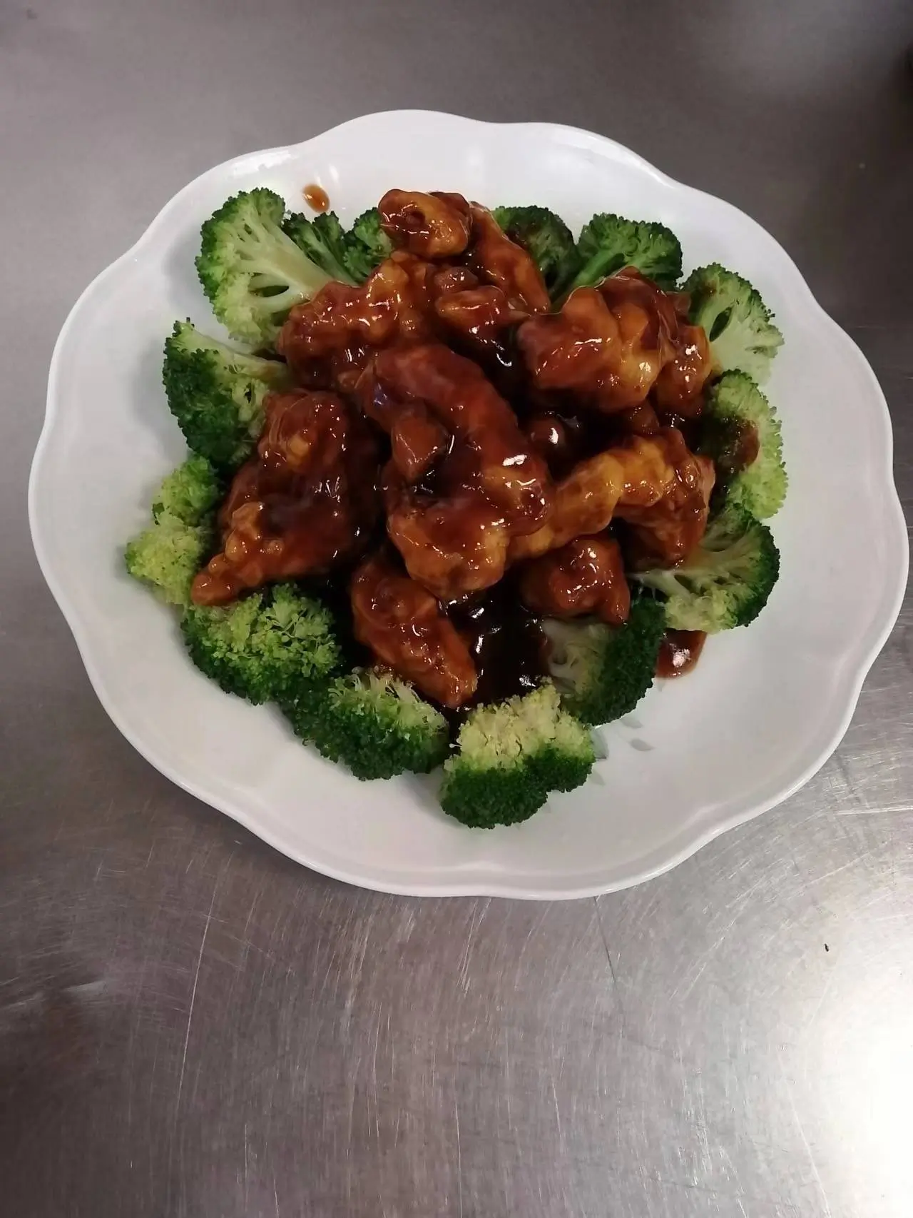Braised pork with broccoli on a plate at New Panda Restaurant, a Chinese Restaurant in Garner