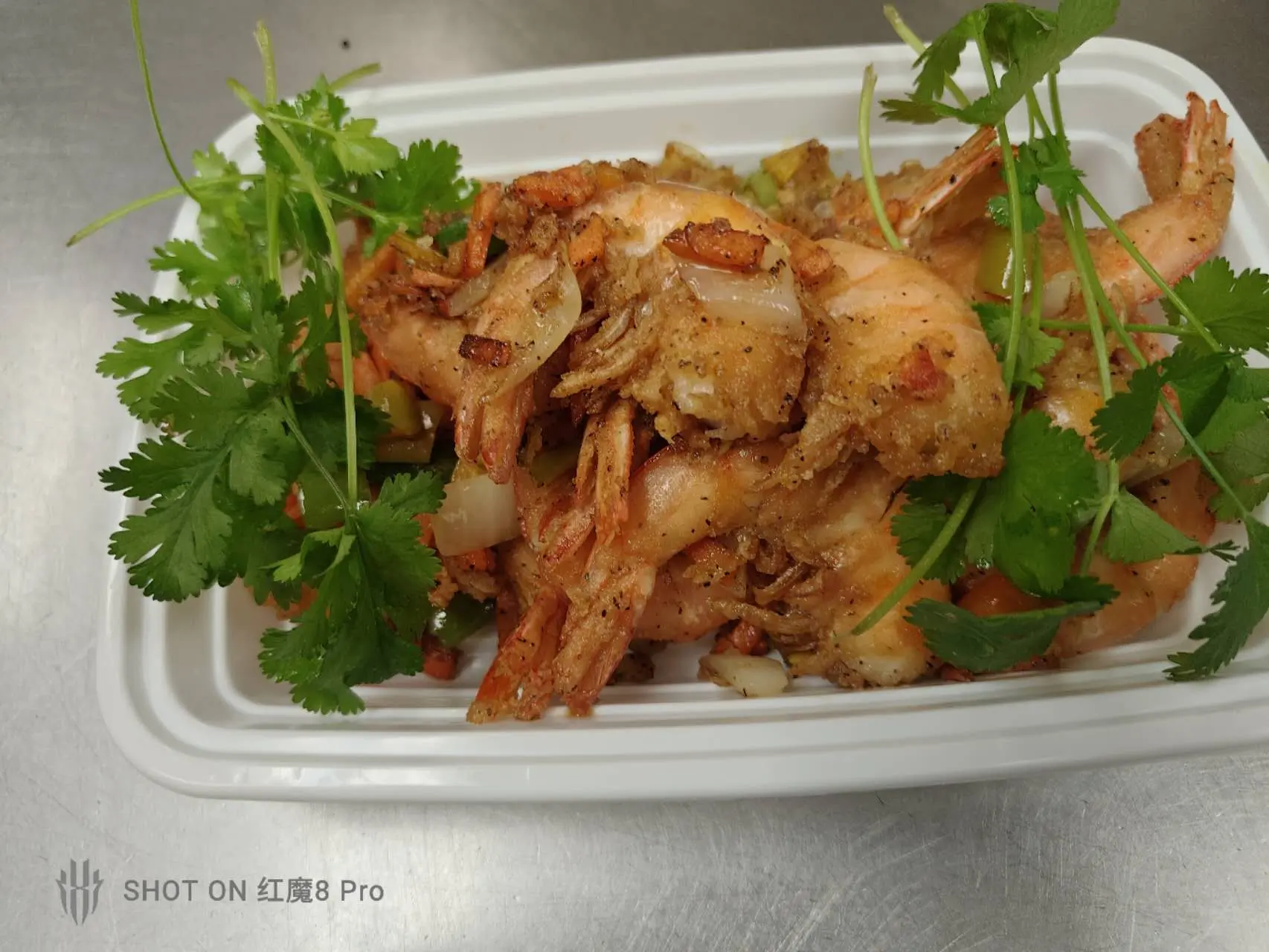 Crispy salt and pepper shrimp garnished with cilantro at New Panda Restaurant, a Chinese Restaurant in Garner