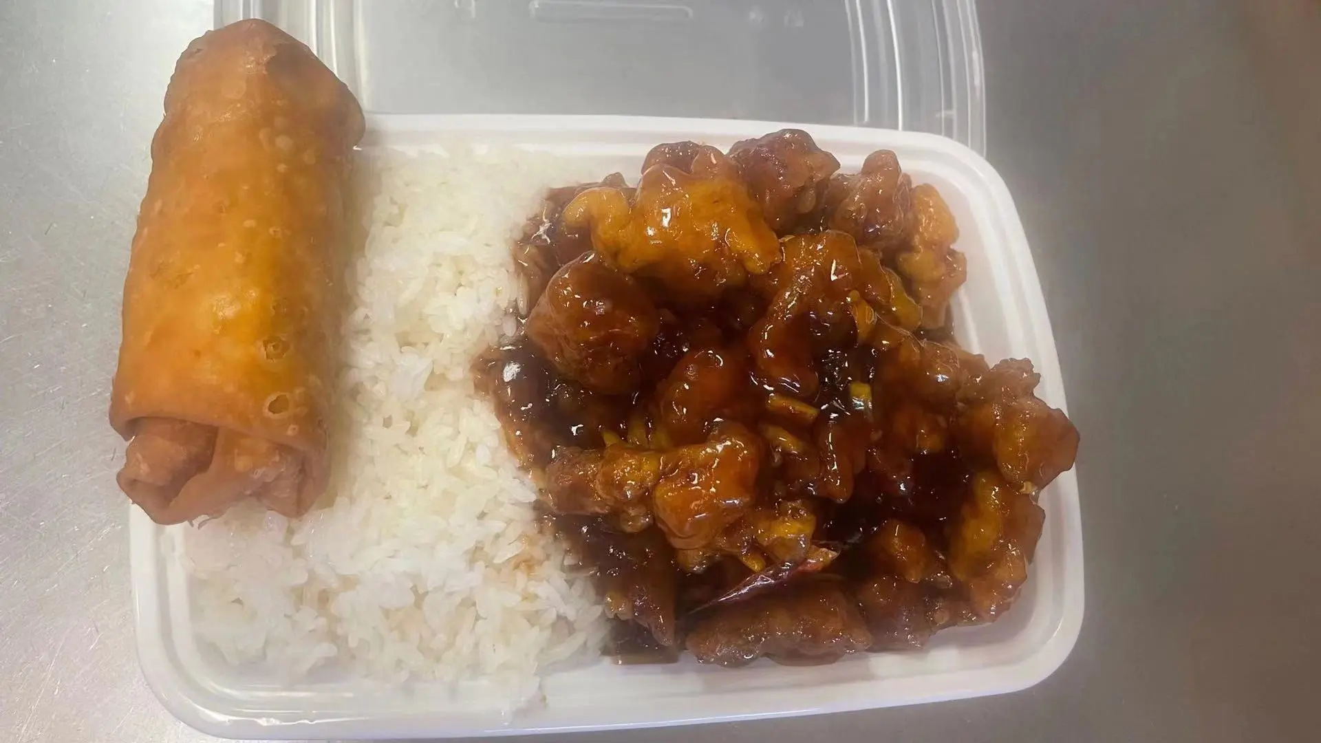 Glazed pork combo with rice and egg roll at New Panda Restaurant, a Chinese Restaurant in Garner