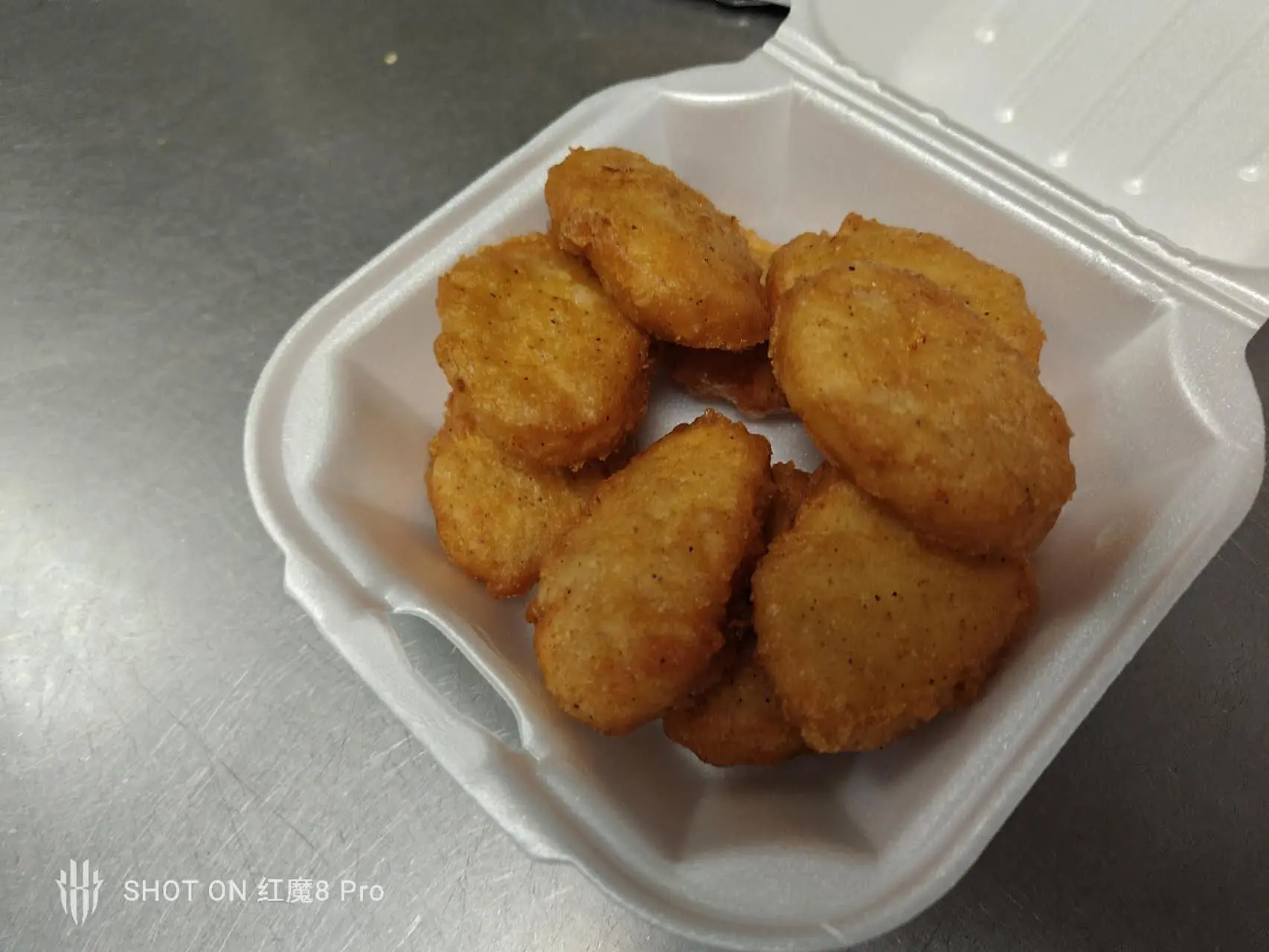 Golden deep-fried chicken nuggets in foam takeout box at New Panda Restaurant, a Chinese Restaurant in Garner
